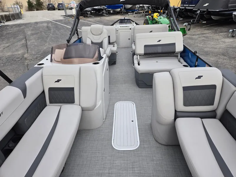 Slide: The Image of 2024 Starcraft CX25RL pontoon boat interior with spacious seating and modern design. - 3