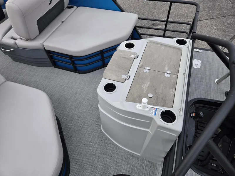 Slide: The Image of 2024 Starcraft CX25RL boat interior with seating and storage compartments. - 7