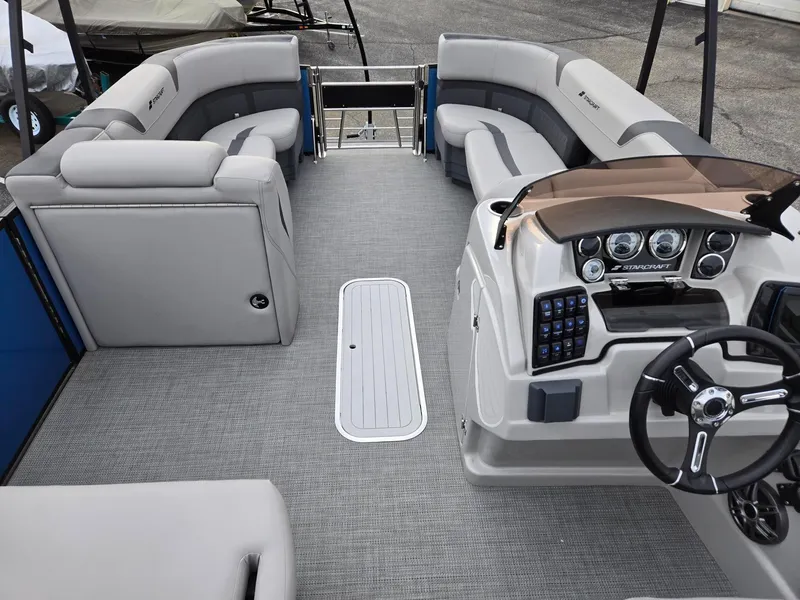 Slide: The Image of 2024 Starcraft CX25RL boat interior with modern seating and control panel. - 8