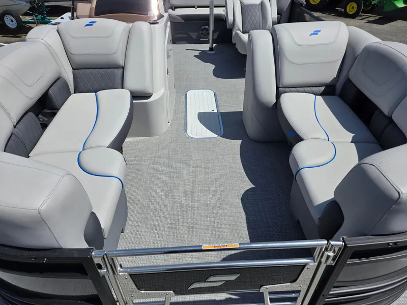 Slide: The Image of 2024 Starcraft Sls3qdh boat interior with gray seating and blue accents. - 6