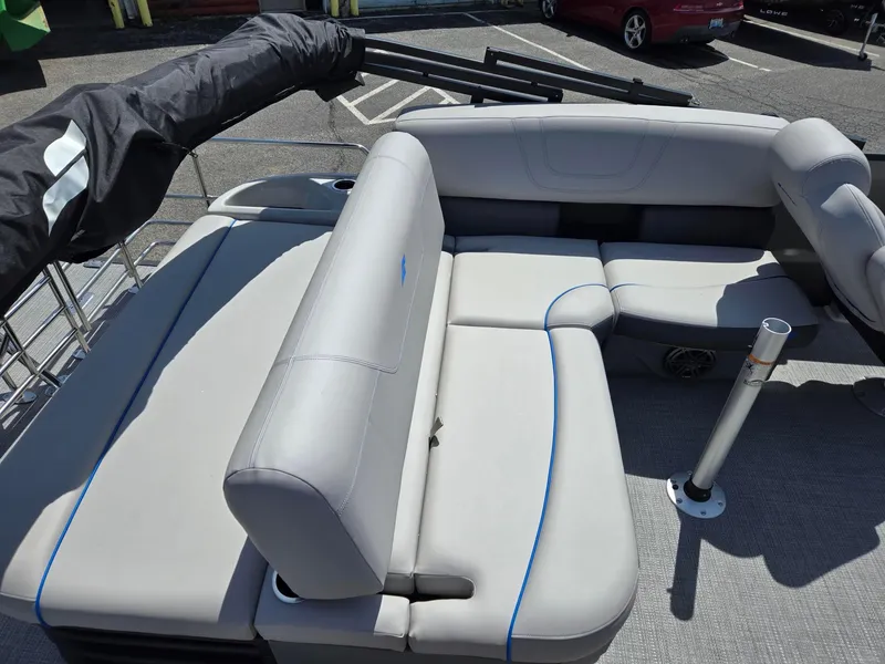 Slide: The Image of 2024 Starcraft Sls3qdh boat interior with gray seating and blue accents. - 8