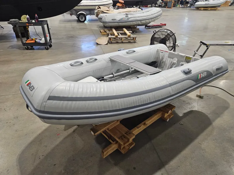 Slide: The Image of 2024 AB Inflatables 9AL boat displayed in a warehouse setting. - 3