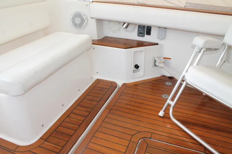 Slide: The Image of 2004 Tiara Yachts 2900 Coronet interior with teak flooring and white seating. - 10