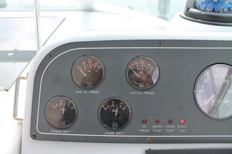 Slide: The Image of Dashboard of a 2004 Tiara Yachts 2900 Coronet showing engine gauges and indicators. - 22