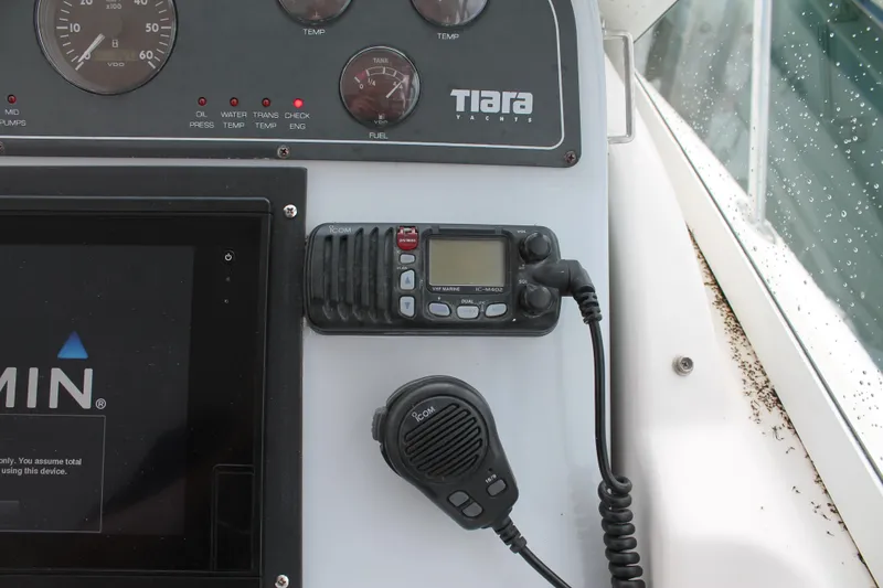 Slide: The Image of 2004 Tiara Yachts 2900 Coronet dashboard with Garmin and Icom marine equipment. - 28