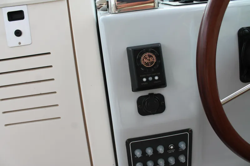 Slide: The Image of Dashboard of a 2004 Tiara Yachts 2900 Coronet with control panel and steering wheel. - 31