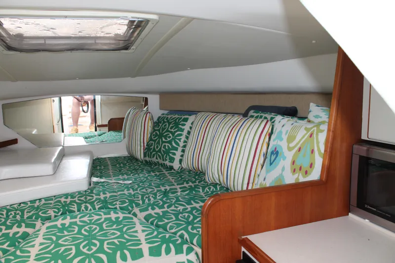 Slide: The Image of Interior of 2004 Tiara Yachts 2900 Coronet with colorful cushions and bedding. - 34