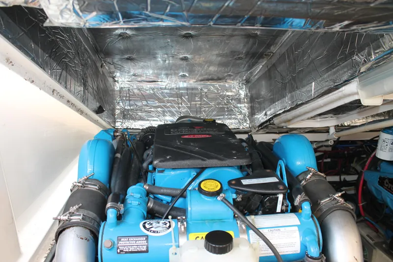 Slide: The Image of Engine compartment of a 2004 Tiara Yachts 2900 Coronet with blue components and insulation. - 41