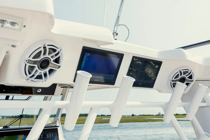 Slide: The Image of 2025 Caymas 44 CT boat dashboard with speakers and digital displays. - 27