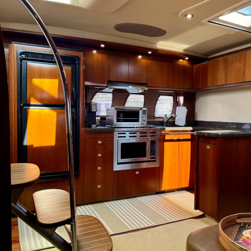 Slide: The Image of Luxurious kitchen interior of 2006 Sea Ray 48 Sundancer yacht with modern appliances. - 18