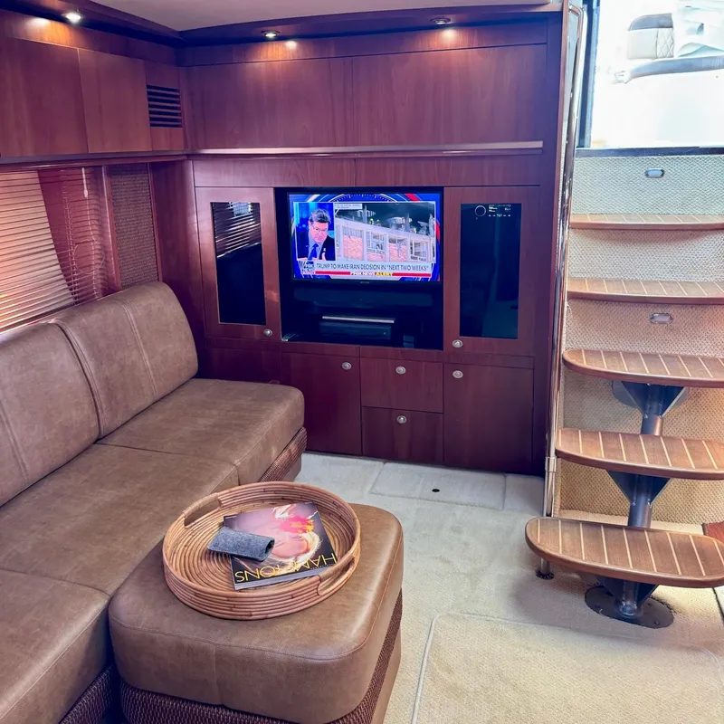 Slide: The Image of Luxurious interior of 2006 Sea Ray 48 Sundancer yacht with TV and elegant seating area. - 20