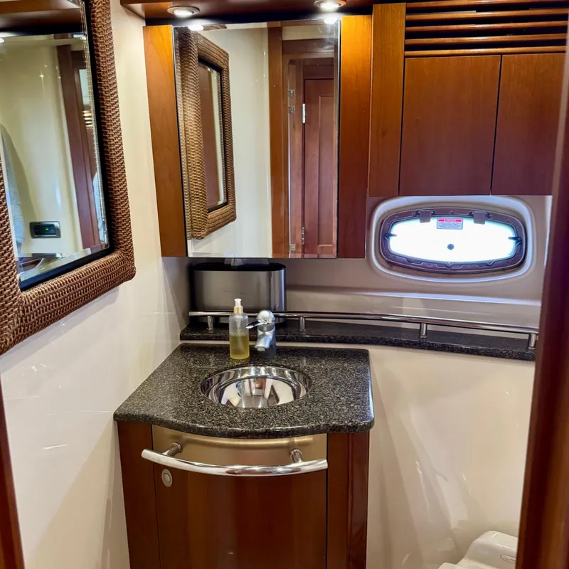 Slide: The Image of Luxurious bathroom in 2006 Sea Ray 48 Sundancer yacht with wood accents and modern fixtures. - 27