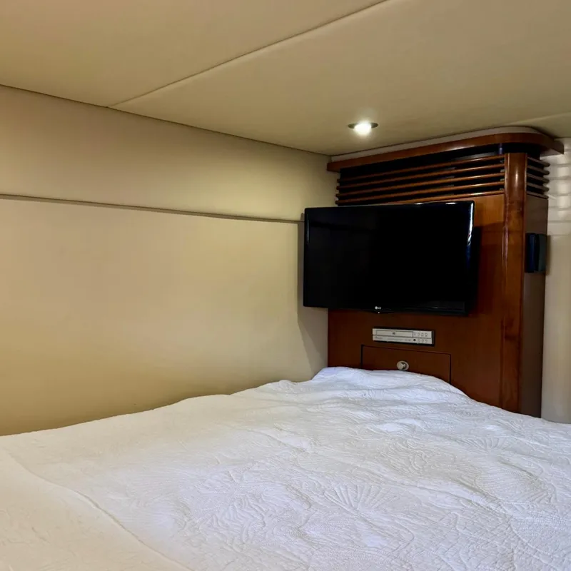 Slide: The Image of Interior cabin of 2006 Sea Ray 48 Sundancer with TV and bed. - 31