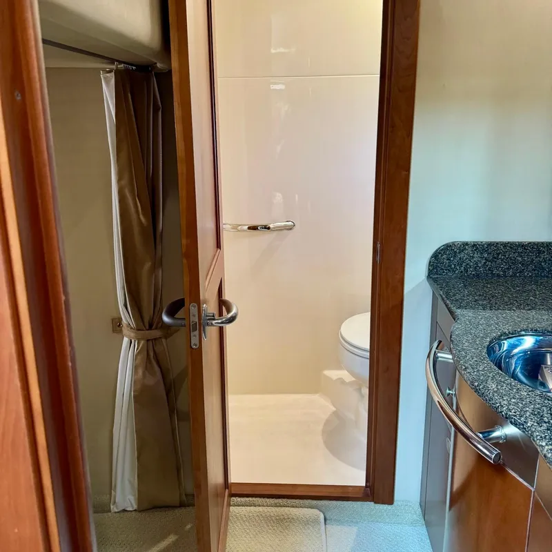 Slide: The Image of Bathroom interior of 2006 Sea Ray 48 Sundancer yacht, featuring a sink and toilet. - 32