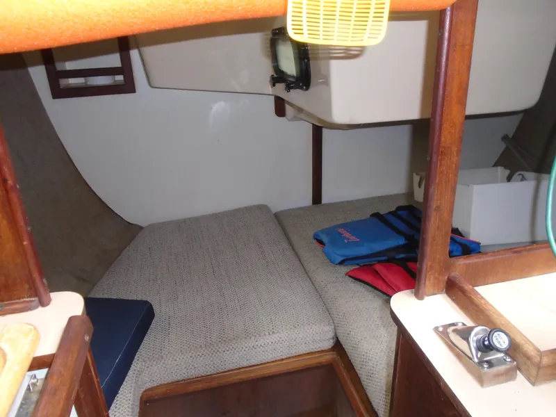 Slide: The Image of Interior cabin of 1989 Hunter 30 sailboat with seating and life jackets. - 6