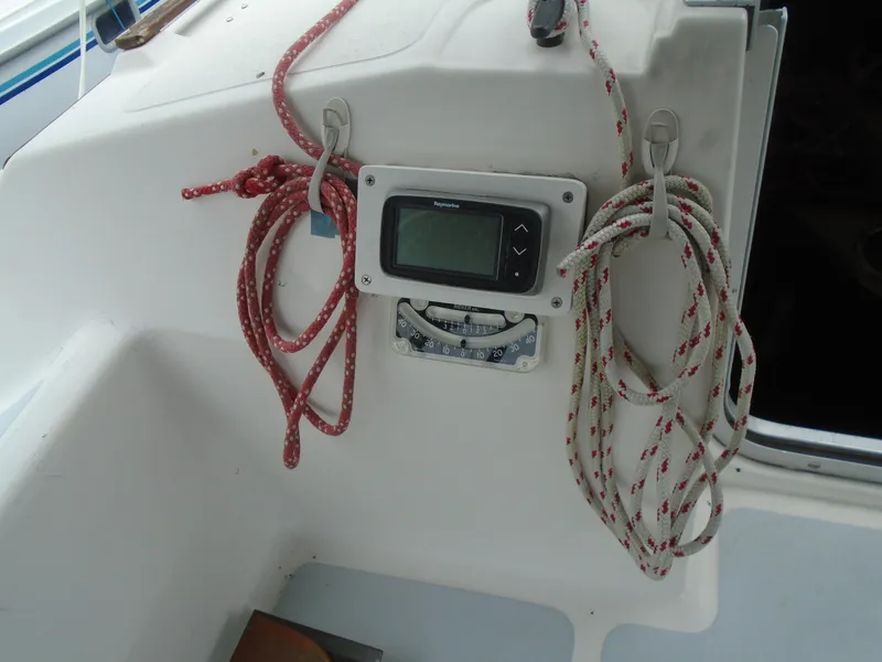 Slide: The Image of Cockpit of 1989 Hunter 30 sailboat with ropes and navigation equipment. - 8