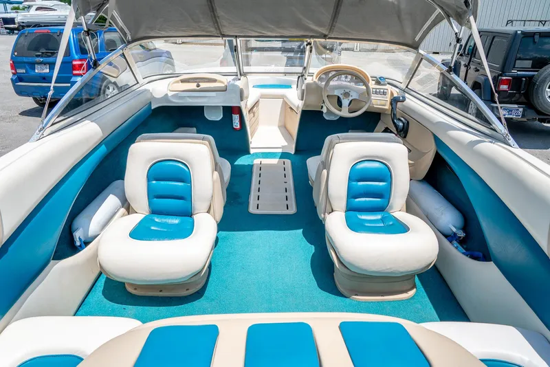 Slide: The Image of Interior of a 1995 Glastron 195 SSV boat with blue and white seating. - 15