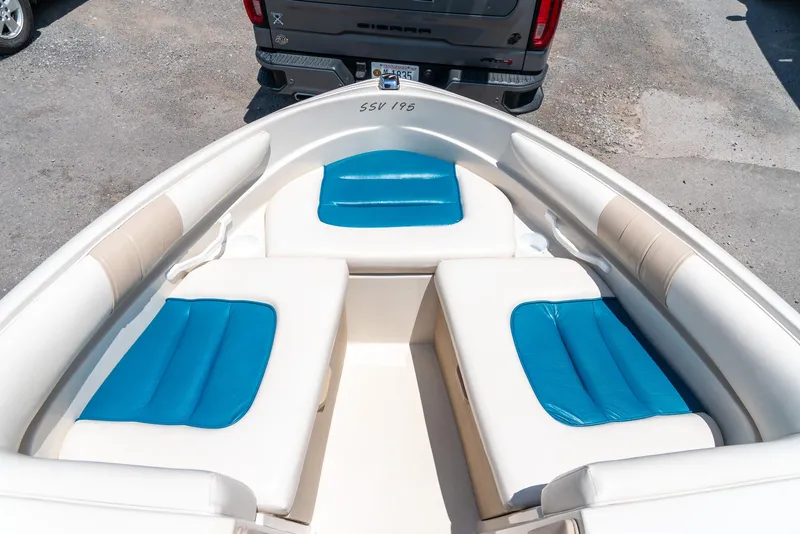 Slide: The Image of 1995 Glastron 195 SSV boat interior with blue and white seating. - 23