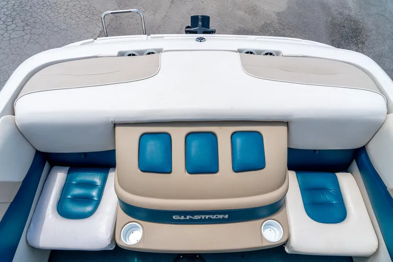 Slide: The Image of 1995 Glastron 195 SSV boat interior with blue and beige seating. - 26