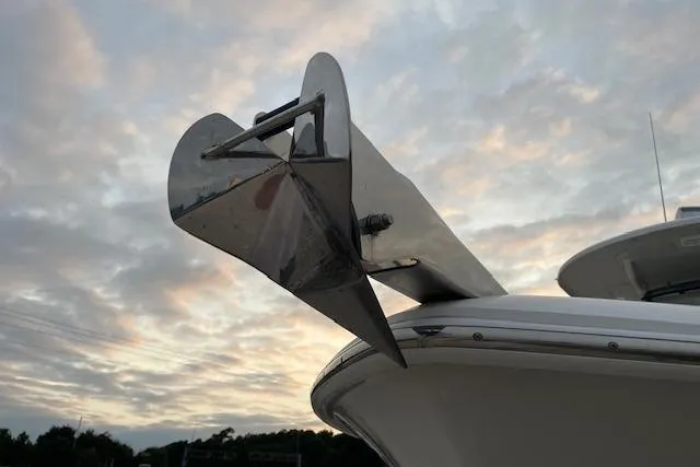 Slide: The Image of 2022 Boston Whaler 25' Outrage boat anchor against a cloudy sky. - 34
