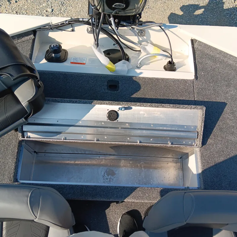 Slide: The Image of 2026 Tracker Pro 170 boat interior with open storage compartment and seating. - 11