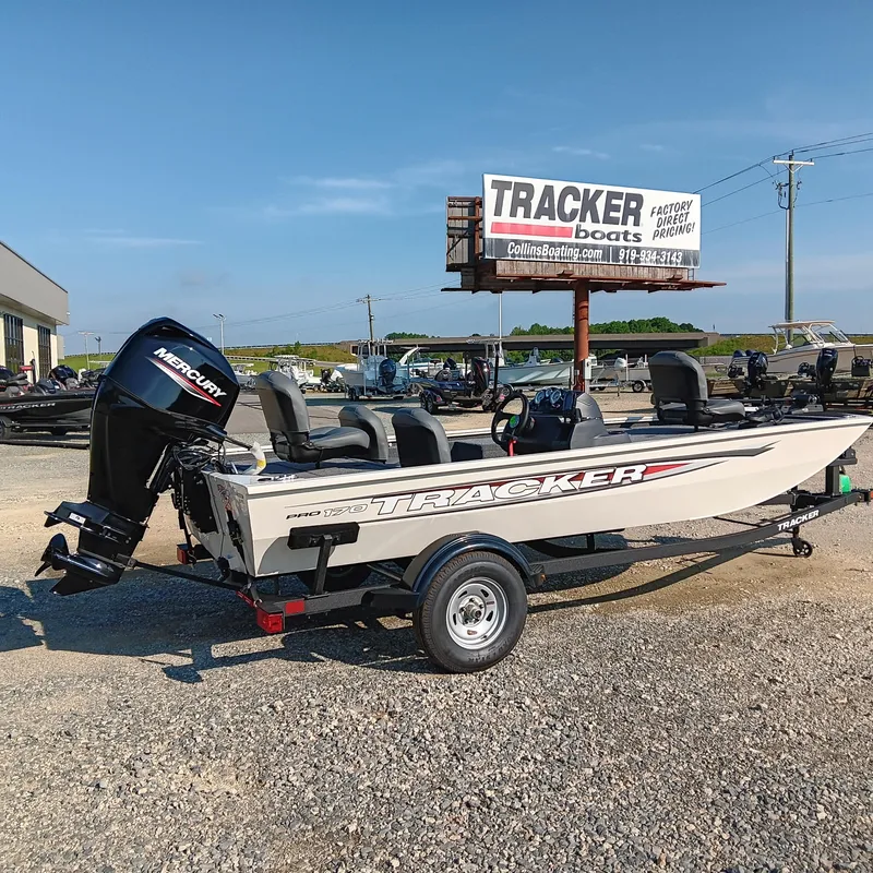 Slide: The Image of 2026 Tracker Pro 170 boat with Mercury engine on display at dealership. - 2