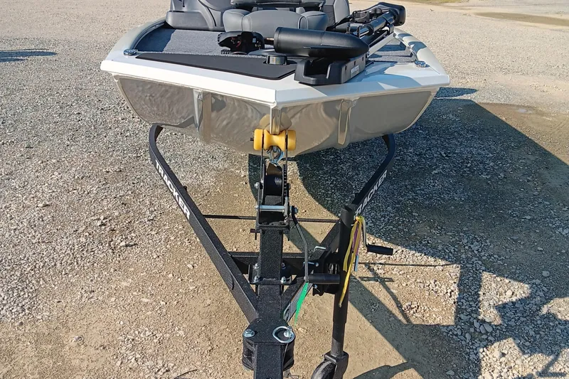 Slide: The Image of 2026 Tracker Pro 170 boat on trailer, parked on gravel surface. - 5