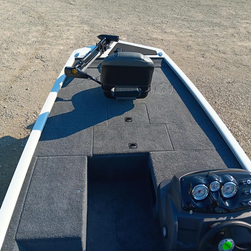 Slide: The Image of 2026 Tracker Pro 170 boat interior with steering console and seating area. - 7