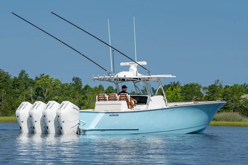 Slide: The Image of 2025 Valhalla Boatworks V-41 with four engines on calm water. - 16