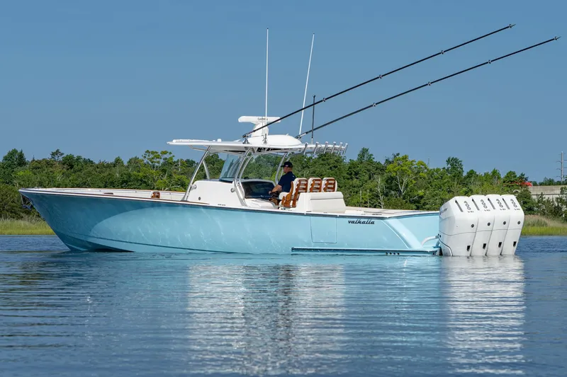 Slide: The Image of 2025 Valhalla Boatworks V-41 in water, featuring sleek design and multiple outboard engines. - 17