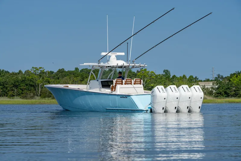 Slide: The Image of 2025 Valhalla Boatworks V-41 with four engines on calm water. - 19