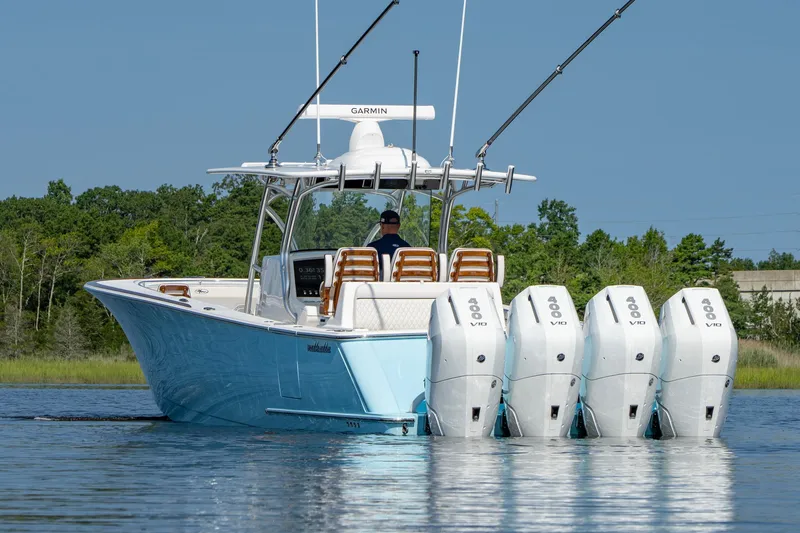 Slide: The Image of 2025 Valhalla Boatworks V-41 with four powerful outboard engines on calm water. - 20