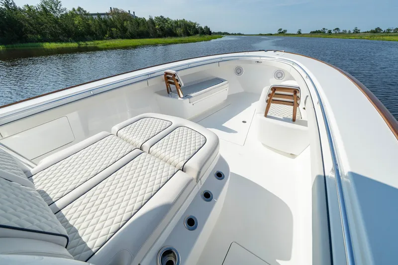 Slide: The Image of Luxurious 2025 Valhalla Boatworks V-41 with elegant seating on a serene waterway. - 23