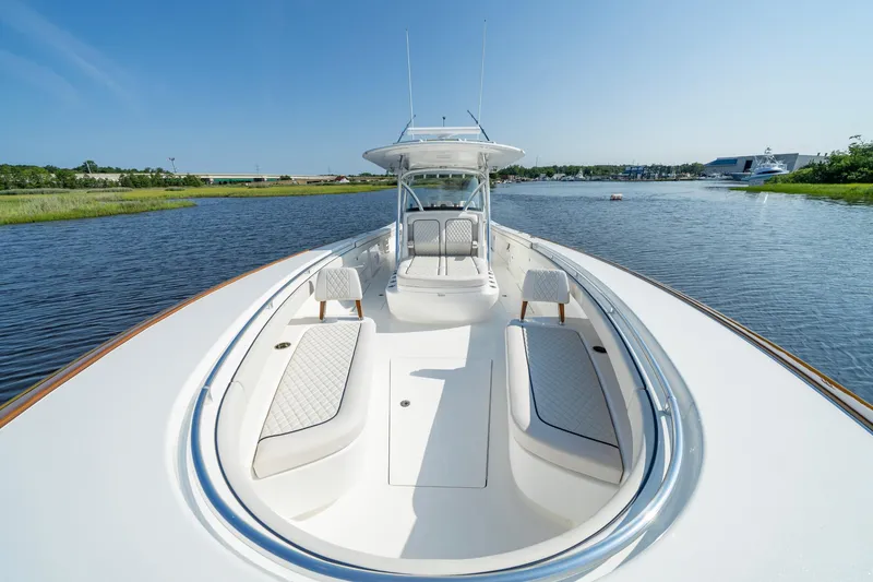 Slide: The Image of 2025 Valhalla Boatworks V-41 on calm water, showcasing sleek design and spacious deck. - 24