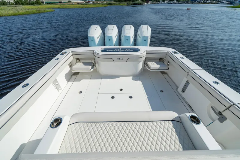 Slide: The Image of 2025 Valhalla Boatworks V-41 with spacious deck and quad engines on a serene waterway. - 29