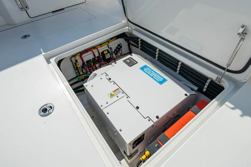 Slide: The Image of 2025 Valhalla Boatworks V-41 electrical compartment with wiring and power unit. - 31