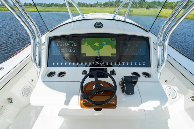 Slide: The Image of 2025 Valhalla Boatworks V-41 helm with advanced navigation displays and controls. - 32