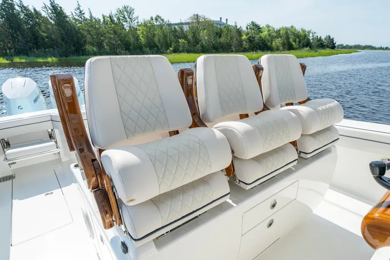 Slide: The Image of Luxurious seating on 2025 Valhalla Boatworks V-41, featuring elegant white upholstery and wooden accents. - 34