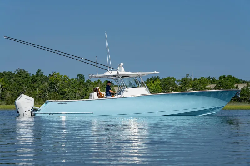 Slide: The Image of 2025 Valhalla Boatworks V-41 in calm waters, showcasing sleek design and powerful engines. - 5