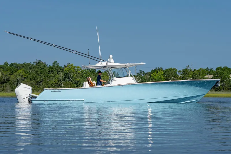 Slide: The Image of 2025 Valhalla Boatworks V-41 in calm waters, showcasing sleek design and powerful engines. - 6