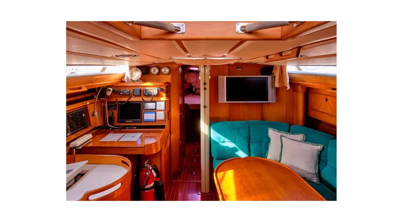 The Image of Sailboat Wauquiez Centurion 45, 1992 model, docked at sunset in a marina. - 0