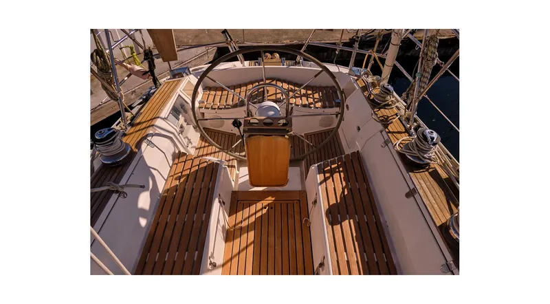 Slide: The Image of Cockpit of 1992 Wauquiez Centurion 45 sailboat with wooden deck and steering wheel. - 12