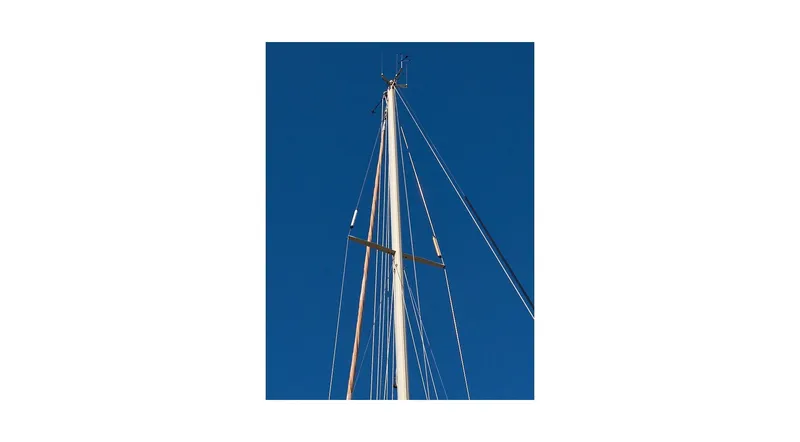 Slide: The Image of Mast and rigging of 1992 Wauquiez Centurion 45 sailboat against clear blue sky. - 14