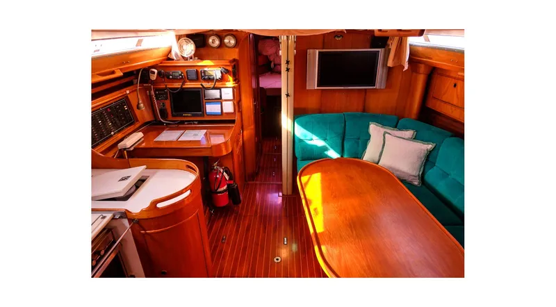 Slide: The Image of Mast of 1992 Wauquiez Centurion 45 sailboat against a cloudy sky. - 2