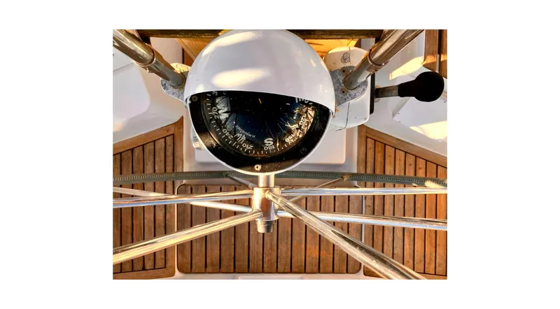 Slide: The Image of Cockpit of 1992 Wauquiez Centurion 45 sailboat with wooden deck and steering wheel. - 41