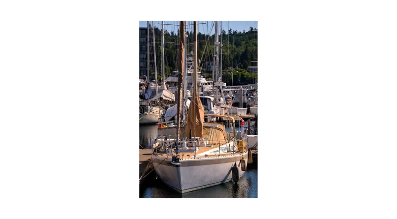 Slide: The Image of Interior of 1992 Wauquiez Centurion 45 yacht, featuring a wooden kitchen with cabinets and a sink. - 6