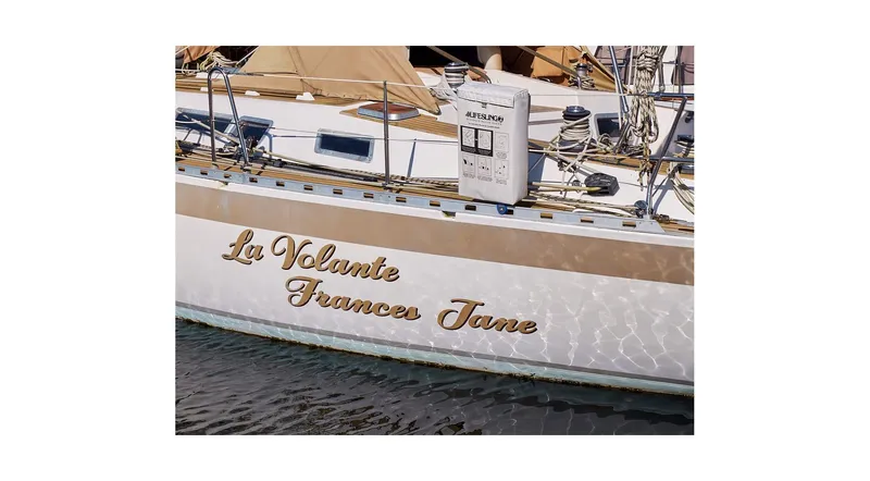 Slide: The Image of Sailboat Wauquiez Centurion 45, 1992 model, docked at marina under clear blue sky. - 8