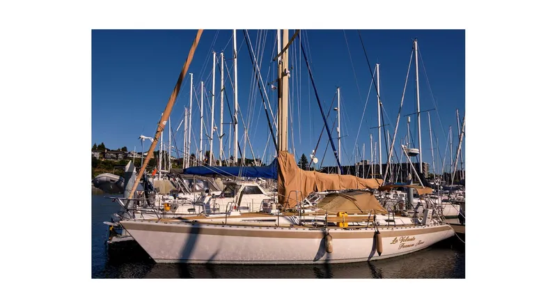 Slide: The Image of Sailboat "La Volante Frances Jane," Wauquiez Centurion 45, 1992, docked with lifebuoy visible. - 9
