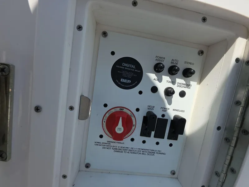 Slide: The Image of Control panel of 2021 Robalo R242 Center Console boat with various switches and dials. - 14