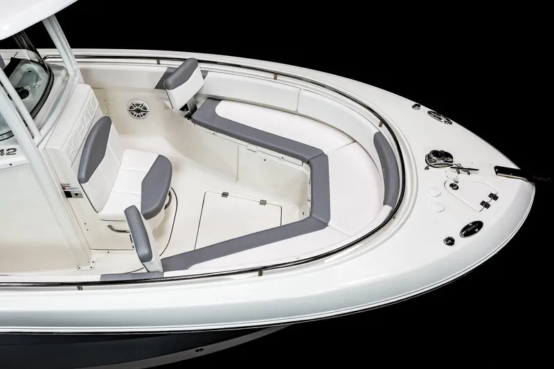 Slide: The Image of Manufacturer Provided Image: 2021 Robalo R242 Center Console boat with cushioned seating and storage compartments. - 20